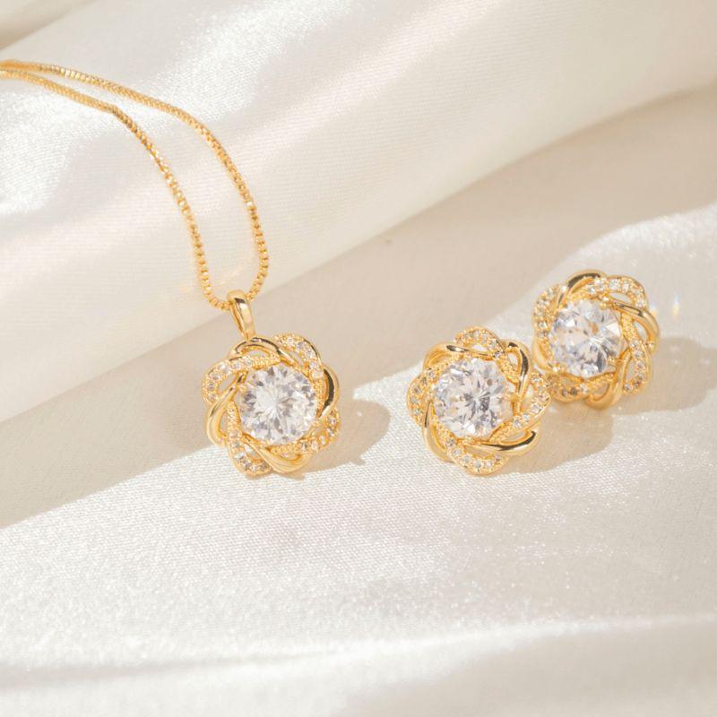 Conjunto Ponto de Luz Volta Cravejada entrelaçada - Banho de Ouro